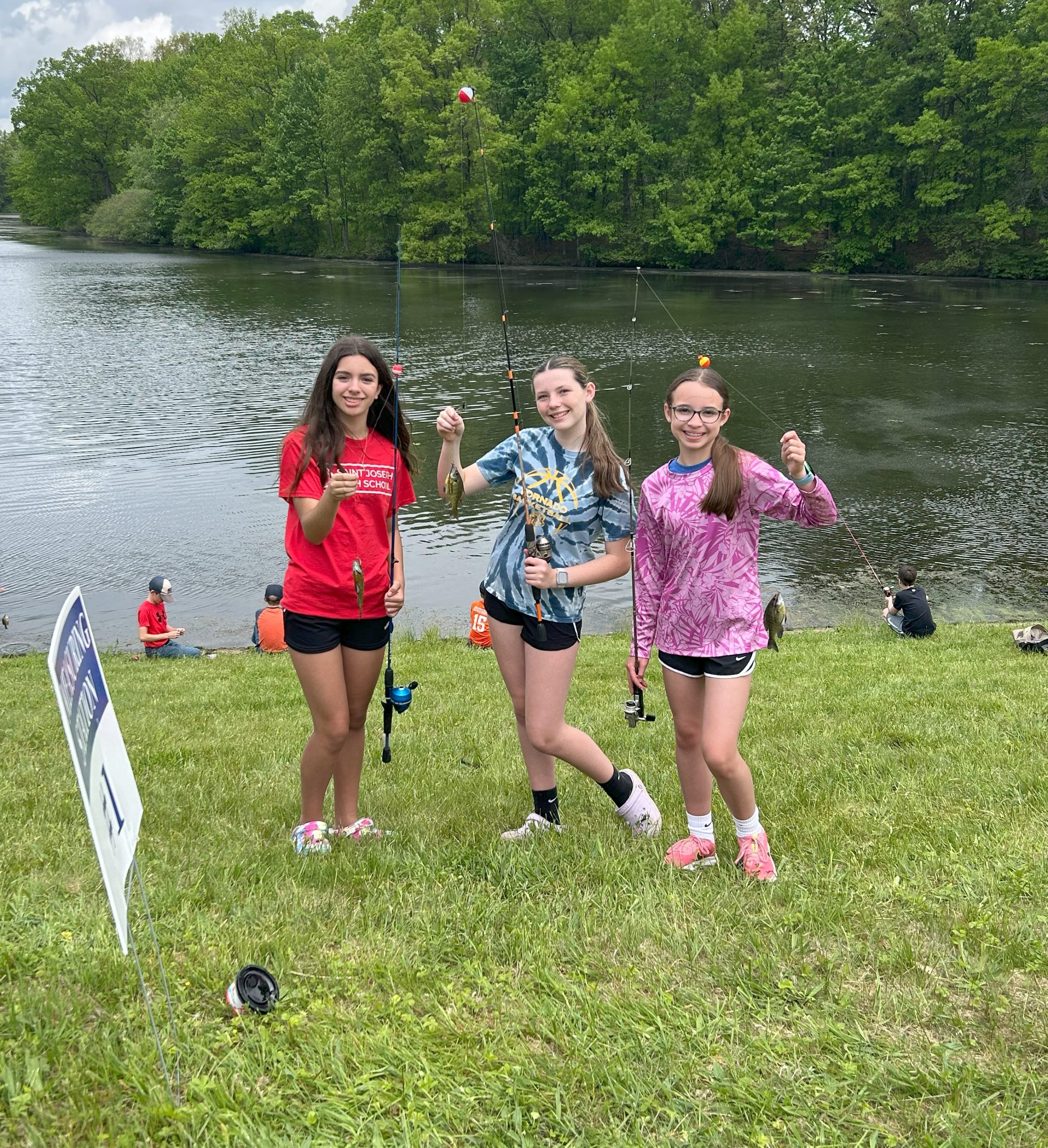 2025 Concordia Fishing Derby: three young anglers pose with their catches